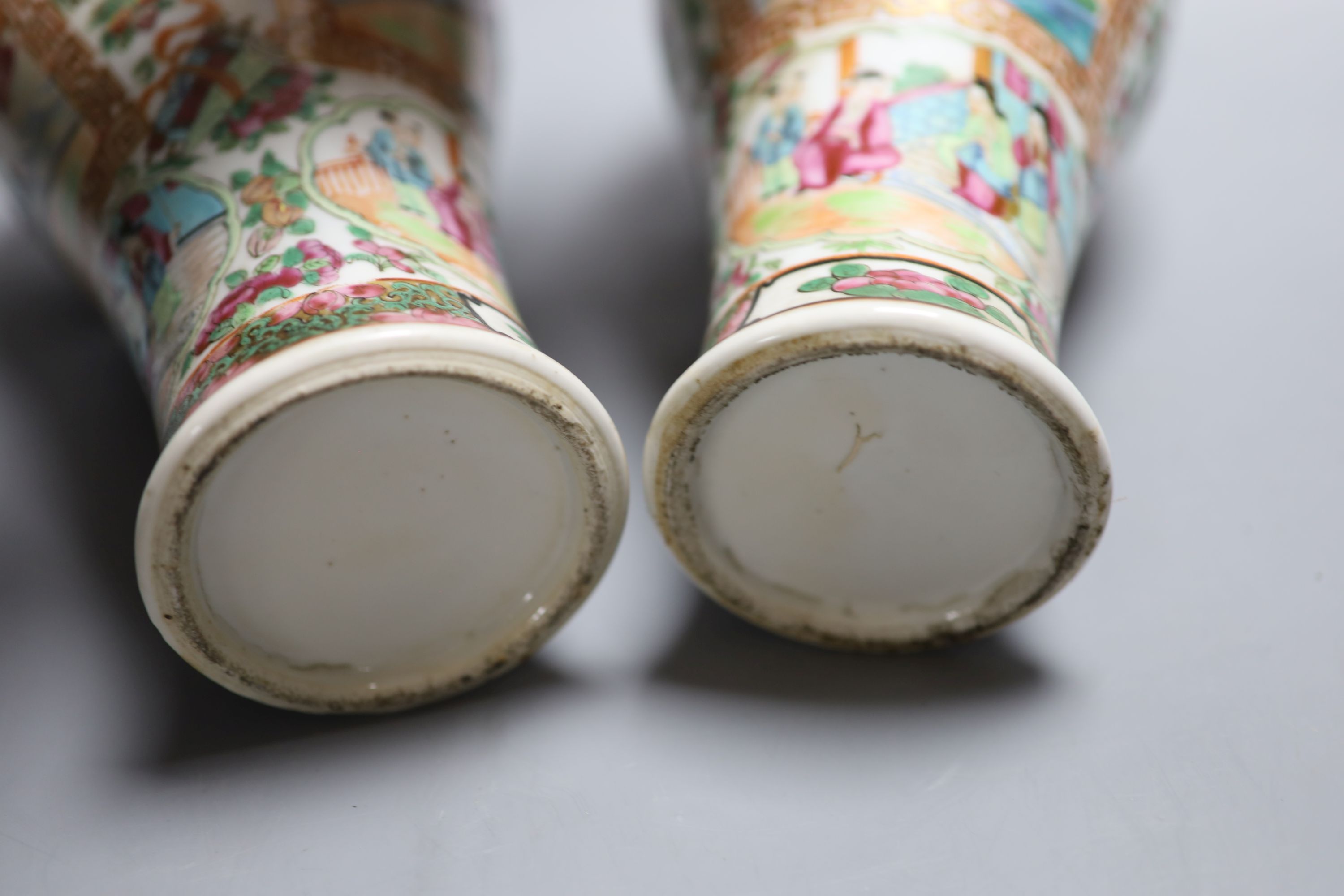 A pair of 19th century Chinese famille rose vases and associated covers, height excl. cover 28cm (a.f.)